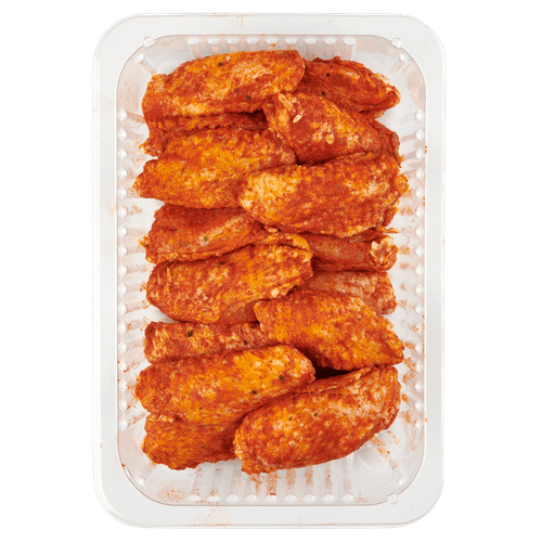 Foto van DekaVers Scharrel kipwings gekruid op witte achtergrond