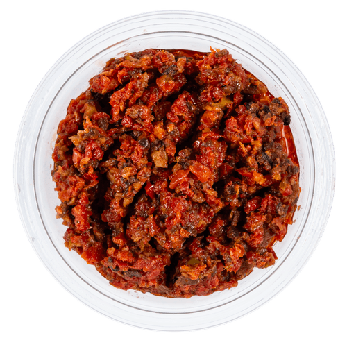 Foto van DekaMarkt Tapenade basilicum op witte achtergrond